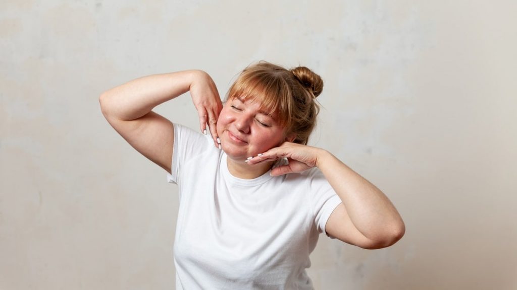 a person with the hands on the face